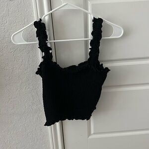 This is a medium, black crop top with ruffle straps from Shein !